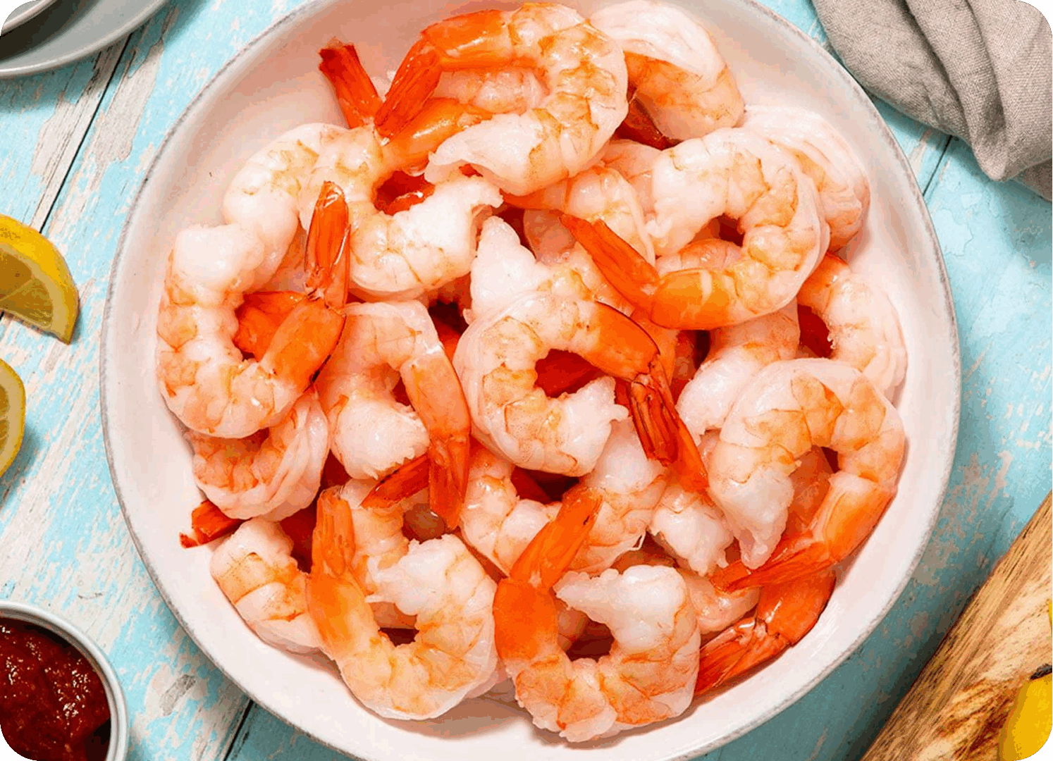 A bowl of cooked shrimp ready to eat.