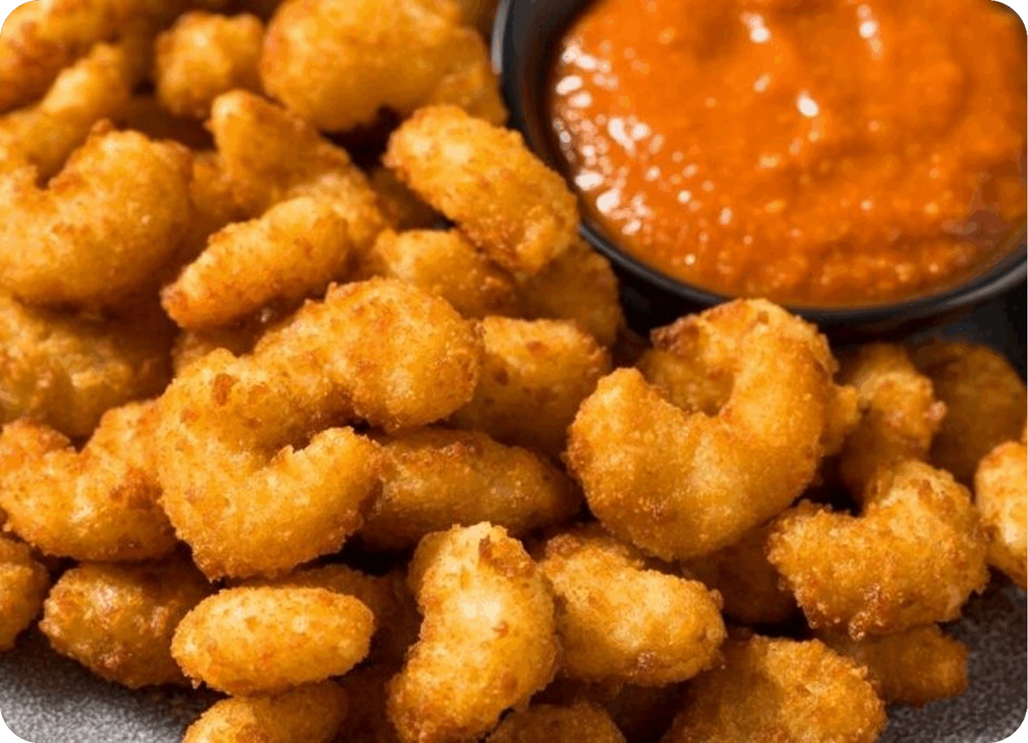Crispy fried shrimp served with a spicy dipping sauce.