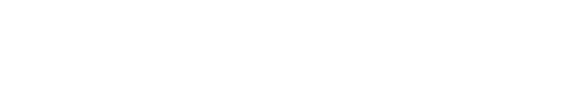 Green hill with a smooth curved shape under a clear sky.